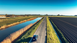 Aerial shot of Bigster SUV driving across flat East Anglia roads